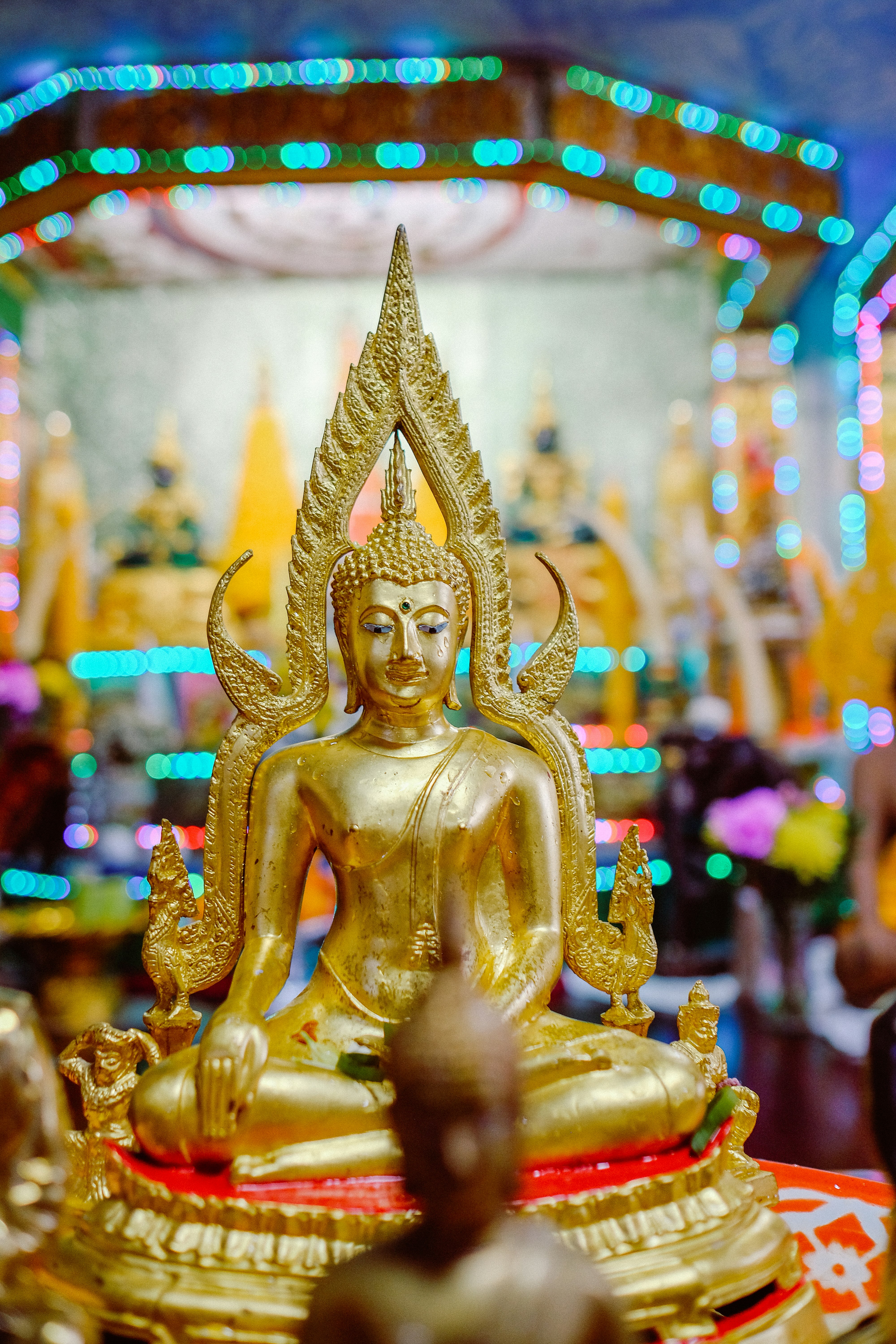 gold hindu deity statue in tilt shift lens